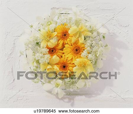 Wreath of flowers hanging on a wall View Large Photo Image Stock Photography - Wreath of flowers hanging on a wall. Fotosearch