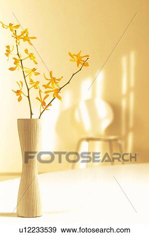 Yellow flowers in a vase View Large Photo Image Stock Photo - Yellow flowers in a vase. Fotosearch