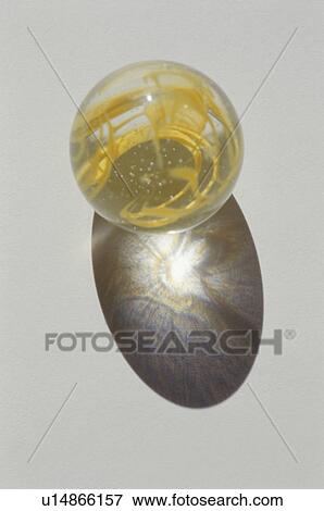 Stock Photo - Yellow marble on white background. Fotosearch