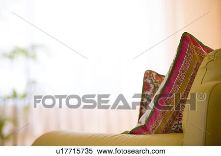 Stock Photography - Yellow sofas with cushions. Fotosearch