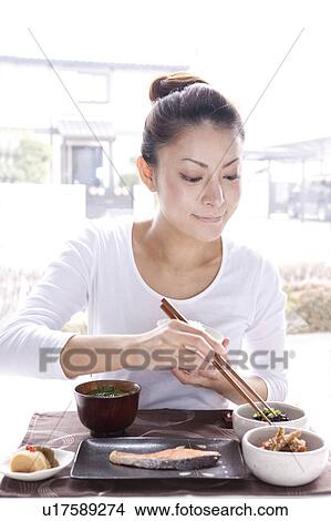 Young Woman Eating Japanese Cuisine View Large Photo Image Picture - Young Woman Eating Japanese Cuisine. Fotosearch