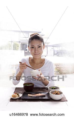 Young Woman Eating Japanese Cuisine View Large Photo Image Stock Photo - Young Woman Eating Japanese Cuisine. Fotosearch
