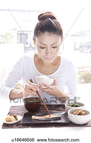 Young Woman Eating Japanese Cuisine View Large Photo Image Stock Photograph - Young Woman Eating Japanese Cuisine. Fotosearch