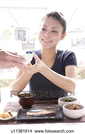 Young Woman Holding Bowl of Rice View Large Photo Image Picture - Young Woman Holding Bowl of Rice. Fotosearch