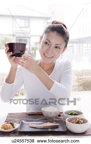 Young Woman Holding Miso Soup Bowl View Large Photo Image Stock Photo - Young Woman Holding Miso Soup Bowl. Fotosearch