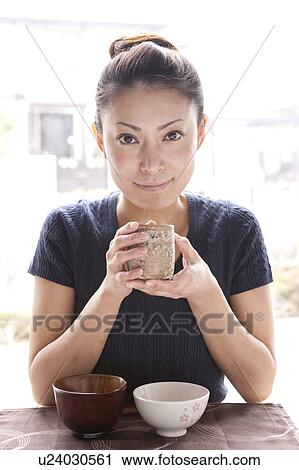Young Woman Holding Tea Cup View Large Photo Image Stock Image - Young Woman Holding Tea Cup. Fotosearch