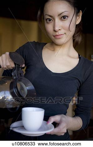 Young Woman Pouring Coffee View Large Photo Image Stock Image - Young Woman Pouring Coffee. Fotosearch