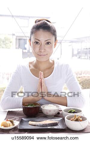 Young Woman Praying for Breakfast View Large Photo Image Picture - Young Woman Praying for Breakfast. Fotosearch