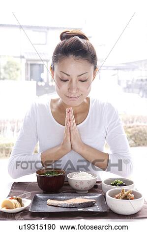 Young Woman Praying for Breakfast View Large Photo Image Stock Image - Young Woman Praying for Breakfast. Fotosearch