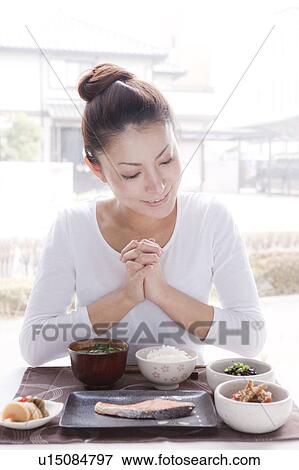 Young Woman Praying for Breakfast View Large Photo Image Stock Photo - Young Woman Praying for Breakfast. Fotosearch
