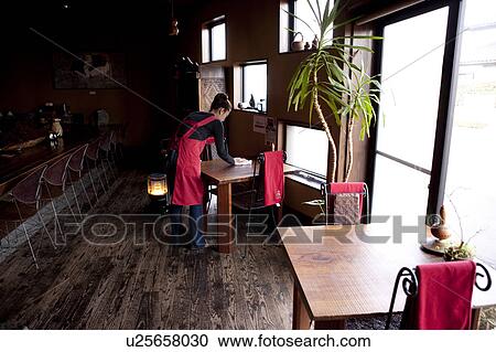 Young Woman Wiping Table View Large Photo Image Stock Image - Young Woman Wiping Table. Fotosearch