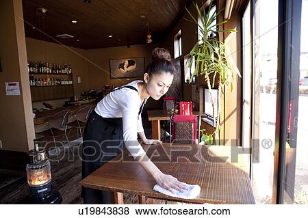 Young Woman Wiping Table View Large Photo Image Stock Photo - Young Woman Wiping Table. Fotosearch