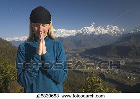 A woman in prayer View Large Photo Image Stock Image - A woman in prayer. Fotosearch