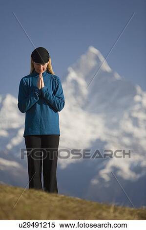 A woman praying View Large Photo Image Stock Photography - A woman praying. Fotosearch
