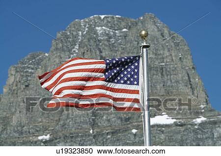American flag flies in front of Clements Mountain, Montana, USA View Large Photo Image Stock Image - American flag flies in front of Clements Mountain, Montana, USA. Fotosearch