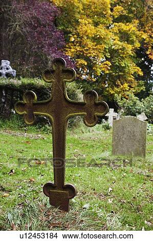Cross grave marker in a cemetery View Large Photo Image Picture - Cross grave marker in a cemetery. Fotosearch