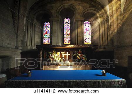 Cross illuminated at the altar of a church View Large Photo Image Stock Image - Cross illuminated at the altar of a church. Fotosearch