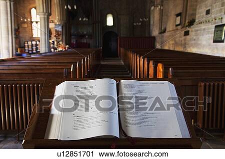 Stock Image - Open Bible at the front of a church. Fotosearch