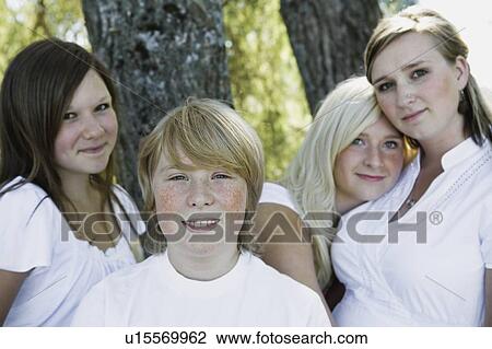 Stock Image - Portrait of four siblings. Fotosearch