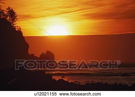 Stock Photography - Sunset on the rugged edge of Ouzette Island, coast of Olympic Peninsula, Washington, USA. Fotosearch