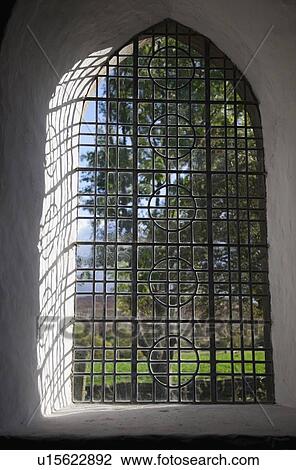 Stock Image - Window covered with bars. Fotosearch