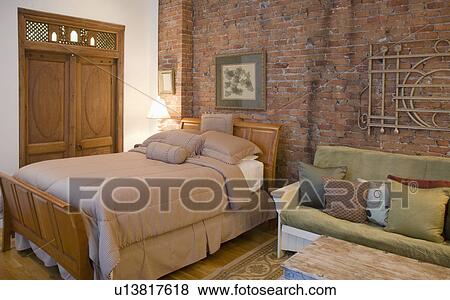 Bed and sofa in studio apartment View Large Photo Image Stock Photo - Bed and sofa in studio apartment. Fotosearch