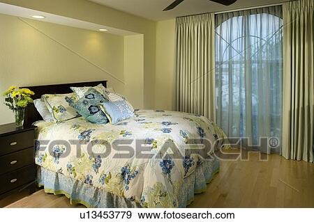 Bedroom with blue and green floral print comforter View Large Photo Image Stock Photo - Bedroom with blue and green floral print comforter. Fotosearch