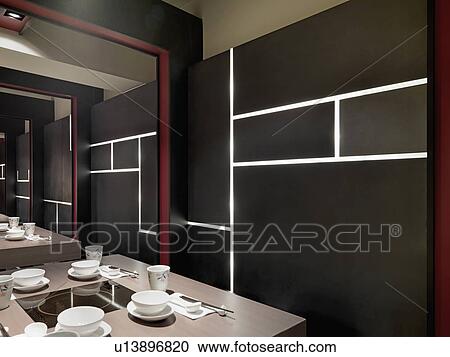 Black wall with built in lights in Asian dining room View Large Photo Image Stock Image - Black wall with built in lights in Asian dining room. Fotosearch