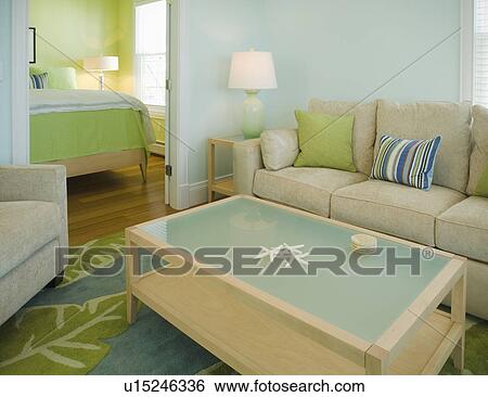 Stock Photograph - Blue and green living room and bedroom. Fotosearch