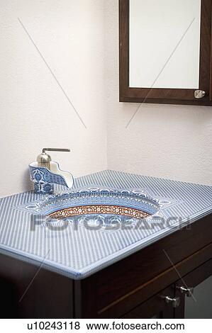 Stock Photo - Blue and red geometric patterned bathroom sink. Fotosearch