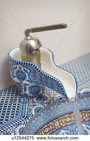 Stock Photography - Blue and red geometric patterned bathroom sink. Fotosearch