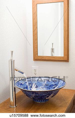 Stock Photo - Blue designed porcelain bowl sink. Fotosearch