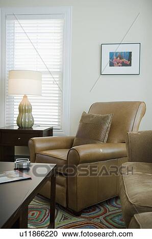 Brown leather armchair with throw pillow View Large Photo Image Stock Image - Brown leather armchair with throw pillow. Fotosearch