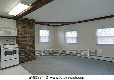 Carpeted room in empty apartment View Large Photo Image Stock Image - Carpeted room in empty apartment. Fotosearch
