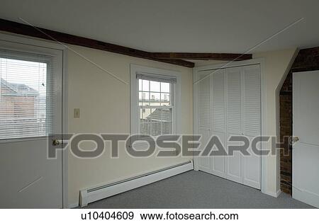 Stock Photo - Closet and front door in empty apartment. Fotosearch