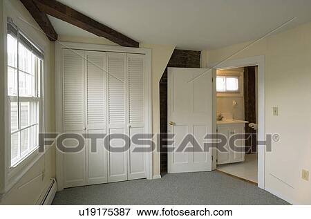 Stock Photo - Closet and front door in empty apartment. Fotosearch