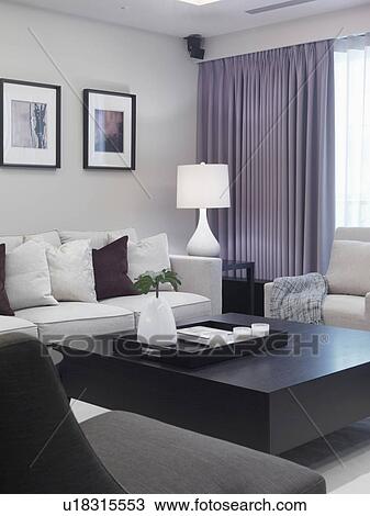 Coffee table in contemporary living room View Large Photo Image Stock Image - Coffee table in contemporary living room. Fotosearch