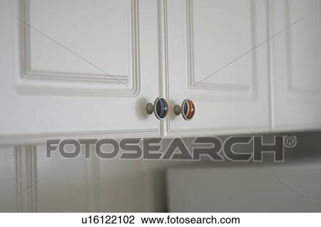Colorful knobs on kitchen cabinet View Large Photo Image Stock Image - Colorful knobs on kitchen cabinet. Fotosearch