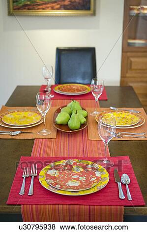 Colorful place settings on dining room table View Large Photo Image Stock Photo - Colorful place settings on dining room table. Fotosearch