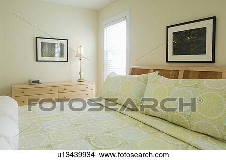 Picture - Comforter and pillows on bed. Fotosearch