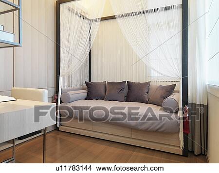 Picture - Contemporary daybed with mosquito net. Fotosearch