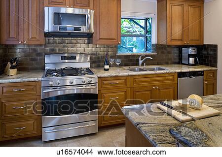 Picture - Contemporary kitchen with stainless steel appliances. Fotosearch
