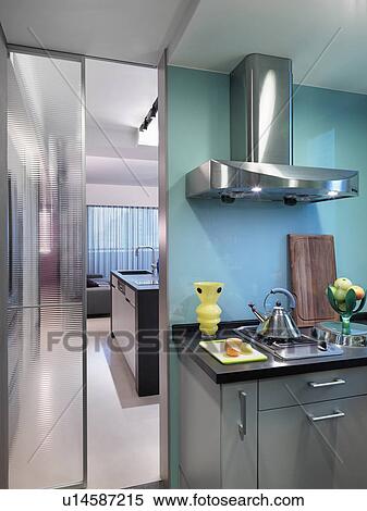 Stock Photography - Countertop and stove in modern blue kitchen. Fotosearch