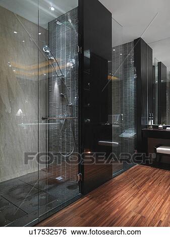 Dark glass shower in bathroom with hardwood floor View Large Photo Image Stock Photograph - Dark glass shower in bathroom with hardwood floor. Fotosearch