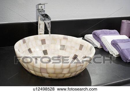 Stock Photo - Detail mosaic tile bowl sink. Fotosearch