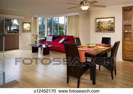 Stock Image - Dining and living room in apartment style home. Fotosearch