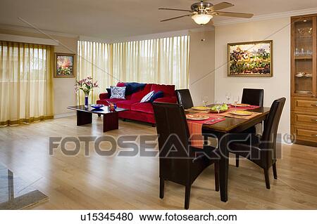 Stock Image - Dining and living room in apartment style home. Fotosearch