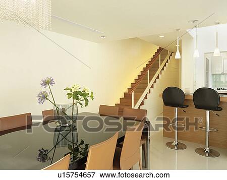 Dining room table in modern home View Large Photo Image Stock Photo - Dining room table in modern home. Fotosearch