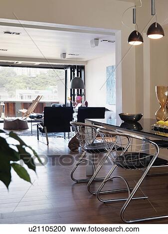 Stock Image - Dining table in modern home. Fotosearch