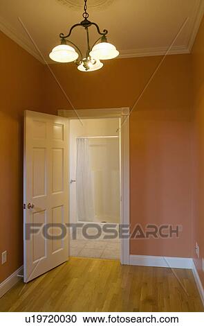 Stock Image - Doorway to bathroom in empty apartment. Fotosearch